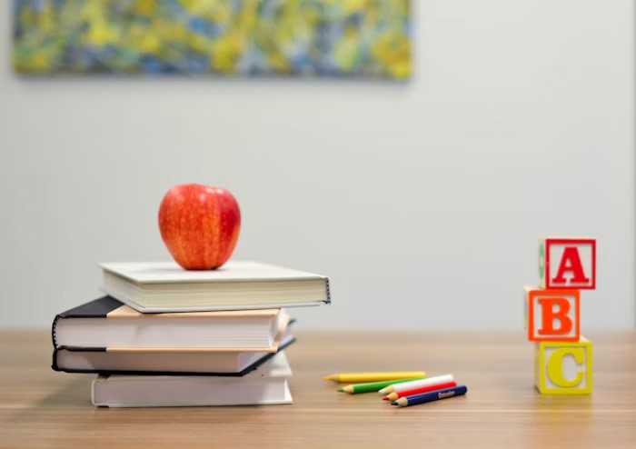 School learning materials on a classroom desk